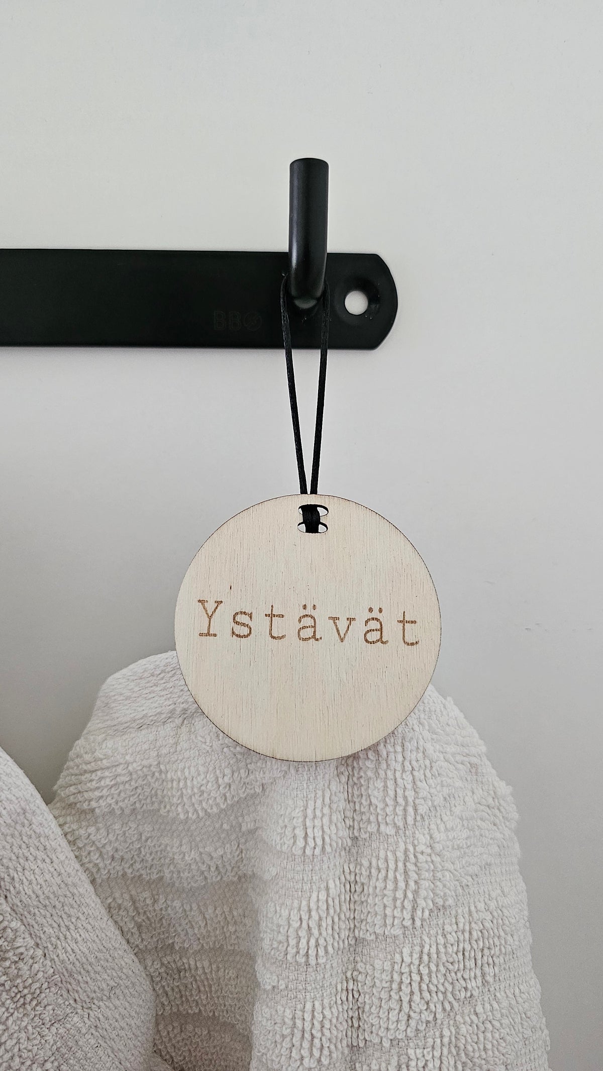 Pyyhemerkki roikkuva omalla nimellä/tekstillä
